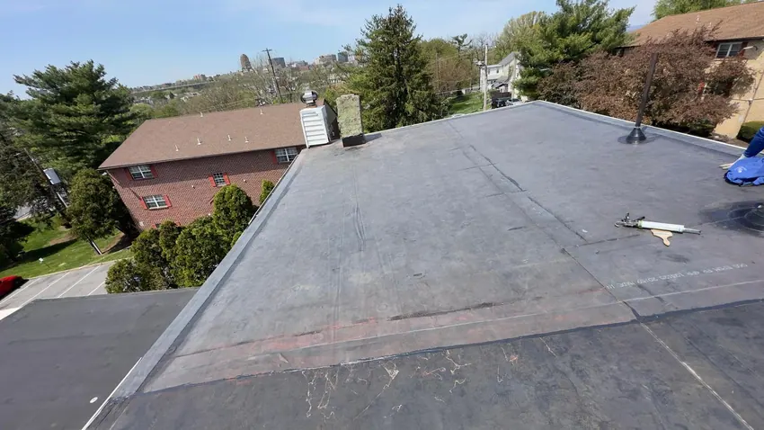 Flat roofing membrane across a large roof area