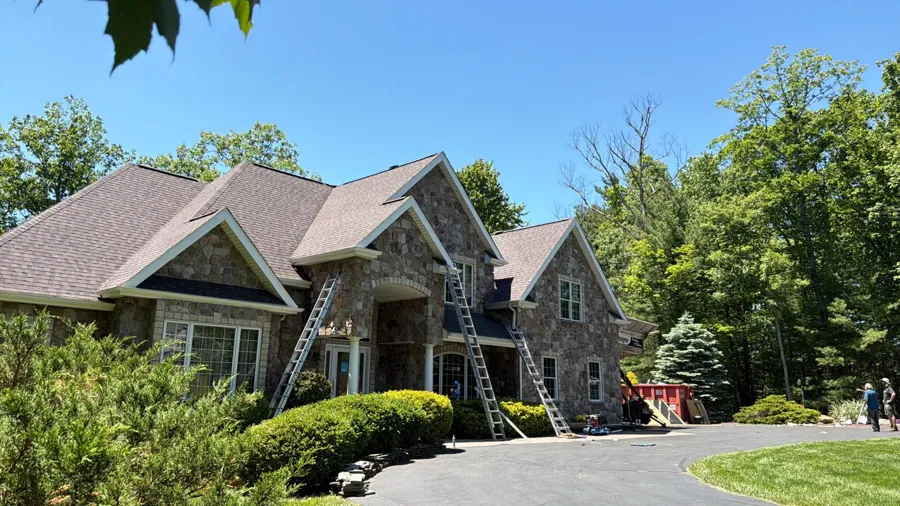 Asphalt shingles being installed