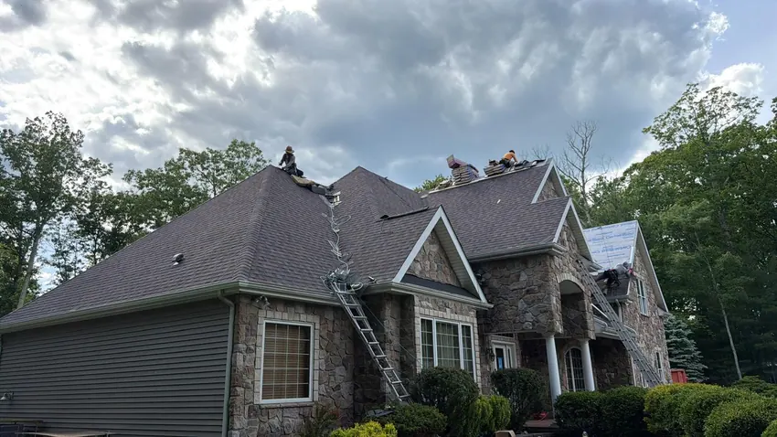 Shingle roofing on a stone-front home